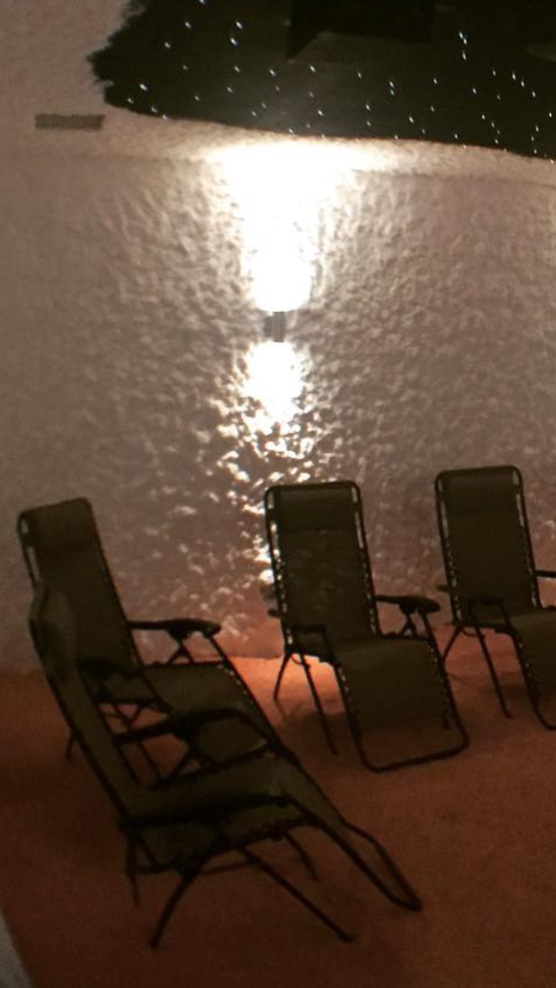 Reclining chairs inside the Himalayan salt therapy room at Salt Spa Haven