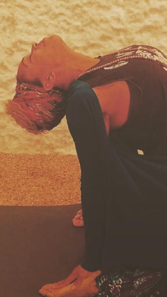 Woman practicing yoga inside the Himalayan salt room at Salt Spa Haven