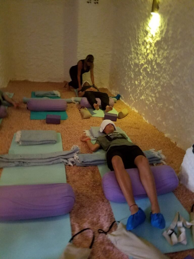 Guests participating in a sound immersion session inside the Himalayan salt room at Salt Spa Haven.